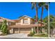 Two-story home with a three-car garage and desert landscaping at 2005 Ridge Rim St, Las Vegas, NV 89117