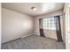 Simple bedroom with gray carpet and window with blinds at 2005 Ridge Rim St, Las Vegas, NV 89117