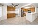 Eat-in kitchen with wood cabinets, stainless steel appliances, and tile flooring at 2005 Ridge Rim St, Las Vegas, NV 89117