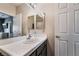 Bright bathroom with white tile and dark brown vanity at 1050 E Cactus Ave # 2094, Las Vegas, NV 89183