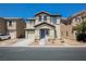 Two-story house with attached garage and a well maintained lawn at 747 Shadwell St, Las Vegas, NV 89178