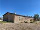 Tan manufactured home with deck and mountain view at 1711 W Leffner Dr, Pahrump, NV 89060