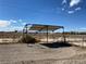 Metal carport structure providing shade and parking at 1711 W Leffner Dr, Pahrump, NV 89060