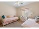 Bedroom with twin beds, a dresser, and ceiling fan at 271 Single Petal St, Henderson, NV 89074