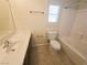 Clean bathroom with bathtub, toilet, and vanity with a sink at 9265 Gentle Cascade Ave, Las Vegas, NV 89178