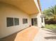 Covered patio adjacent to the house with an orange-toned concrete floor at 9265 Gentle Cascade Ave, Las Vegas, NV 89178