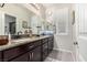 Elegant bathroom with granite countertops and dark wood cabinets at 8337 Sonora Del Sol St, Las Vegas, NV 89113