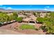 Aerial view of a house with a backyard, landscaping, and mountain views at 1445 Palm Dr, Laughlin, NV 89029