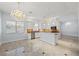 Modern white kitchen with island and breakfast bar at 8127 Dolce Volpe Ave, Las Vegas, NV 89178