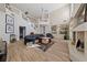 Two-story living room with hardwood floors and a fireplace at 8713 W Gilmore Ave, Las Vegas, NV 89129