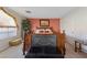 Bedroom with wooden bed frame and coral wall at 8713 W Gilmore Ave, Las Vegas, NV 89129