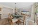 Formal dining room with glass-top table and chandelier at 8713 W Gilmore Ave, Las Vegas, NV 89129