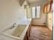 Laundry room with sink, cabinets, and wood floor at 171 Jeri Dr, Henderson, NV 89074