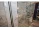 Modern shower with glass enclosure and marble tile at 4381 W Flamingo Rd # 2302, Las Vegas, NV 89103