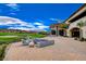 Relaxing patio with fire pit and comfortable seating at 33 Reverie Heights Ave, Henderson, NV 89011