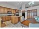 Kitchen features granite countertops, wood cabinets, and an island with wine rack at 2213 Fawn Ridge St, Las Vegas, NV 89134