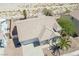 Single-story house with a two-car garage and desert landscaping at 2888 Cattail Cove St, Laughlin, NV 89029