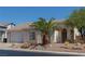 Single-story home with garage and desert landscaping at 2888 Cattail Cove St, Laughlin, NV 89029