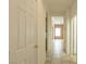 Bright hallway with tile floor and access to rooms at 2888 Cattail Cove St, Laughlin, NV 89029