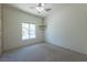 Bedroom with window, ceiling fan and neutral wall colors at 2888 Cattail Cove St, Laughlin, NV 89029