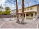 Spacious backyard with covered patio and palm trees at 1211 Red Jade Ct, Henderson, NV 89014