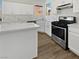 Bright kitchen featuring stainless steel appliances and white cabinetry at 9186 Spumante Ave, Las Vegas, NV 89148