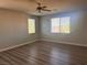 Bright and airy bedroom with ceiling fan and two windows at 720 Oak Hills Course Dr, Las Vegas, NV 89148