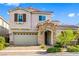 Two-story house with stone accents and a landscaped yard at , Henderson, NV 89044