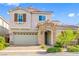 Two-story house with stone accents and a landscaped yard at , Henderson, NV 89044