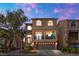 Two story house with balcony and landscaping at dusk at 4552 Mission Meadow Cir, Las Vegas, NV 89139