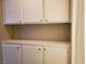 White cabinets offer extra storage space at 7008 Copperleaf Dr, Las Vegas, NV 89128