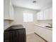 Laundry room with washer, dryer, cabinets, and countertop at 9028 Firebird Dr, Las Vegas, NV 89134