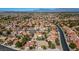 Aerial view of homes and community in a desert setting at 9028 Firebird Dr, Las Vegas, NV 89134