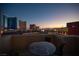 Balcony with glass-top table and chairs, offering city views at 200 W Sahara Ave # 501, Las Vegas, NV 89102