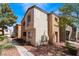 Tan and gray two-story building with walkway and landscaping at 3151 Soaring Gulls Dr # 1049, Las Vegas, NV 89128