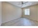 Bright bedroom with ceiling fan and tile flooring at 2428 Hydrus Ave, Henderson, NV 89044