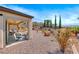 Spacious backyard with desert landscaping and seating area at 2428 Hydrus Ave, Henderson, NV 89044