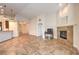 Living area with tile floors, fireplace, and built-in shelving at 159 Birch Ridge Ave, Las Vegas, NV 89183