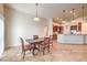 Dining area with dark wood table and chairs near sliding doors at 159 Birch Ridge Ave, Las Vegas, NV 89183