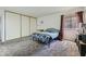 Bedroom with double bed, closet, and carpeted floor at 745 N Royal Crest Cir # 115, Las Vegas, NV 89169