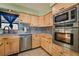 Kitchen features stainless steel appliances and wood cabinets at 1430 Red Rock Dr, Pahrump, NV 89048