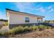 Tan exterior with stone accents and a tiled roof at 1430 Red Rock Dr, Pahrump, NV 89048