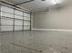 Attached garage with epoxy flooring and extra storage space at 3614 Calmosa St, Las Vegas, NV 89103