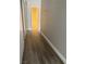 Hallway with wood-look flooring leading to bathroom at 3614 Calmosa St, Las Vegas, NV 89103