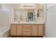 Bathroom with double vanity and a bathtub at 5116 Vista Del Rancho Way, North Las Vegas, NV 89031