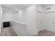 Upstairs hallway featuring carpet, doors, and a storage cabinet at 7013 Fossil Rim St # 0, North Las Vegas, NV 89084