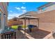 Backyard patio featuring cozy outdoor seating beneath a shaded gazebo, plus additional dining area at 7013 Fossil Rim St # 0, North Las Vegas, NV 89084