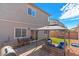 Backyard featuring a brick patio, a covered seating area, artificial grass, and a barbecue grill at 7013 Fossil Rim St # 0, North Las Vegas, NV 89084