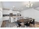 Bright eat-in kitchen featuring stainless steel appliances, granite counters, and an island with bar stool seating at 7013 Fossil Rim St # 0, North Las Vegas, NV 89084