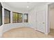 Bright dining room with large windows and tile floor at 6741 Kyle Stewart Ct, North Las Vegas, NV 89086